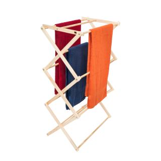 Wooden drying rack with three towels in red, blue, and orange, isolated on a white background.